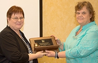 Connie_Johansen_passing_the_gavel_to_Susanne_Loomis.jpg